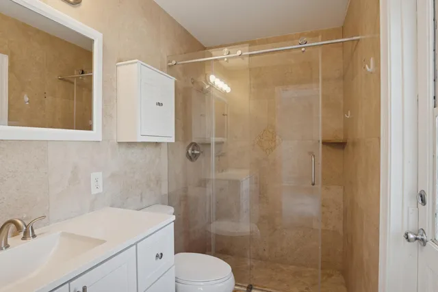 a view of a white house with a yard