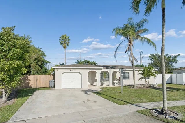 a backyard of a house with lots of green space