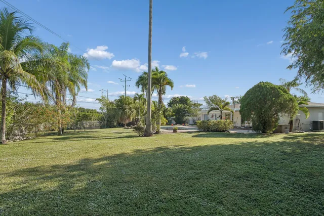 a view of kitchen with refrigerator oven and cabinets