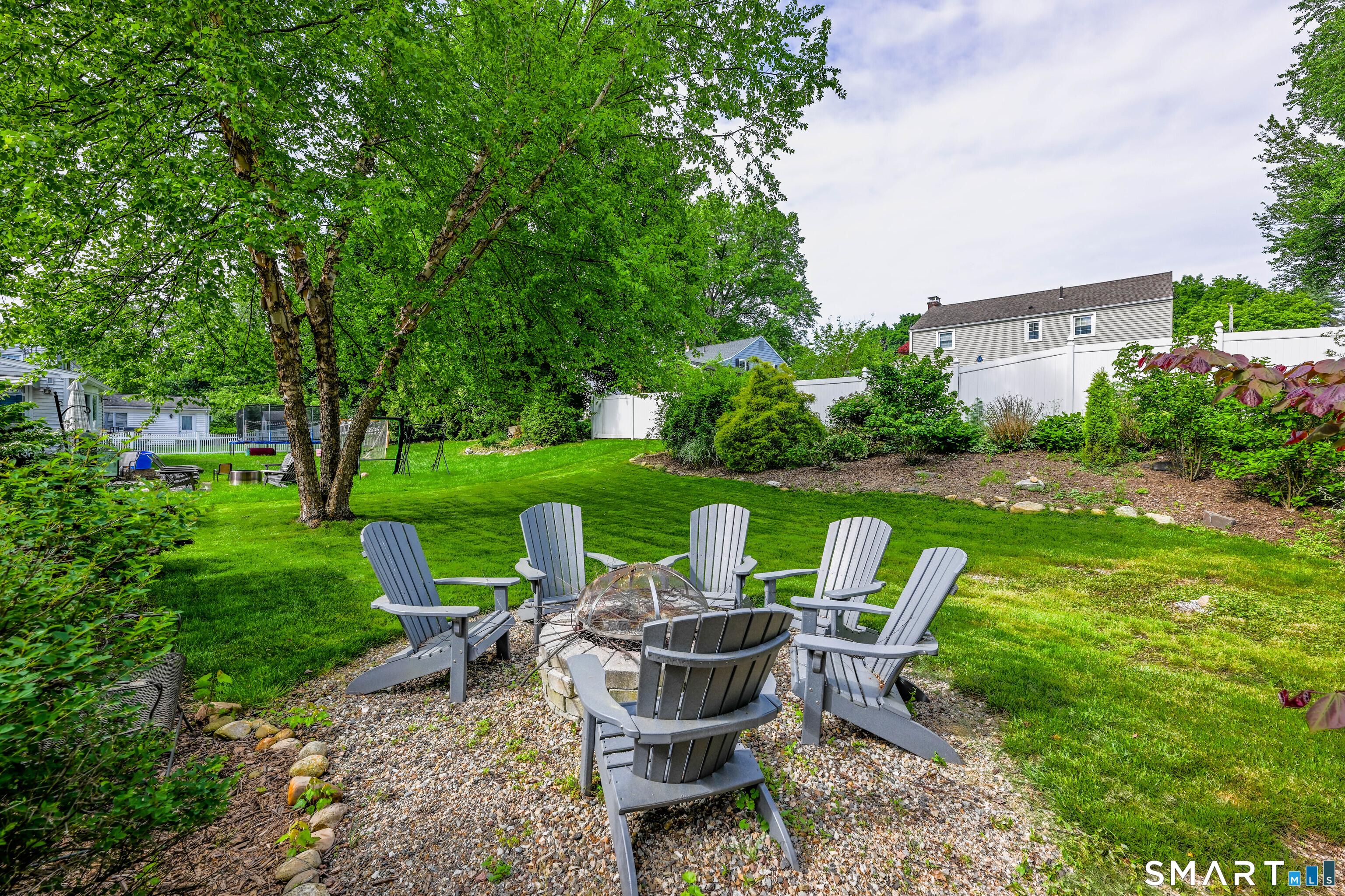 47 Spring Lane West Hartford, CT 06107 - Photo 19 of 38 a view of a table and chairs in the garden