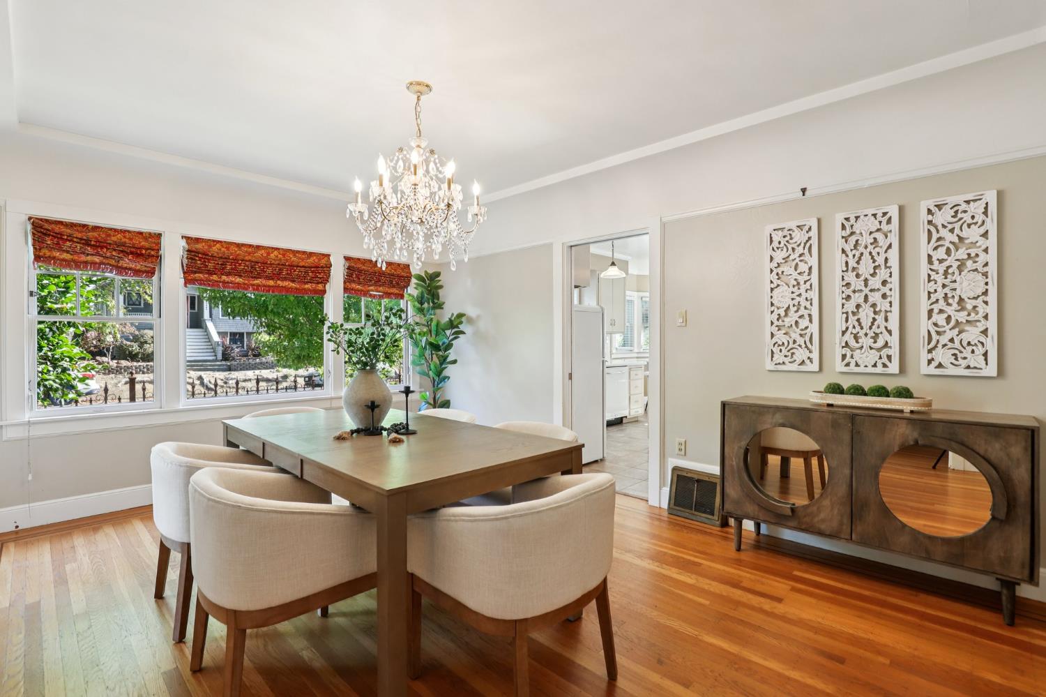 2200 2nd Avenue Sacramento, CA 95818 - Photo 16 of 69 a dining room with furniture a large window and wooden floor