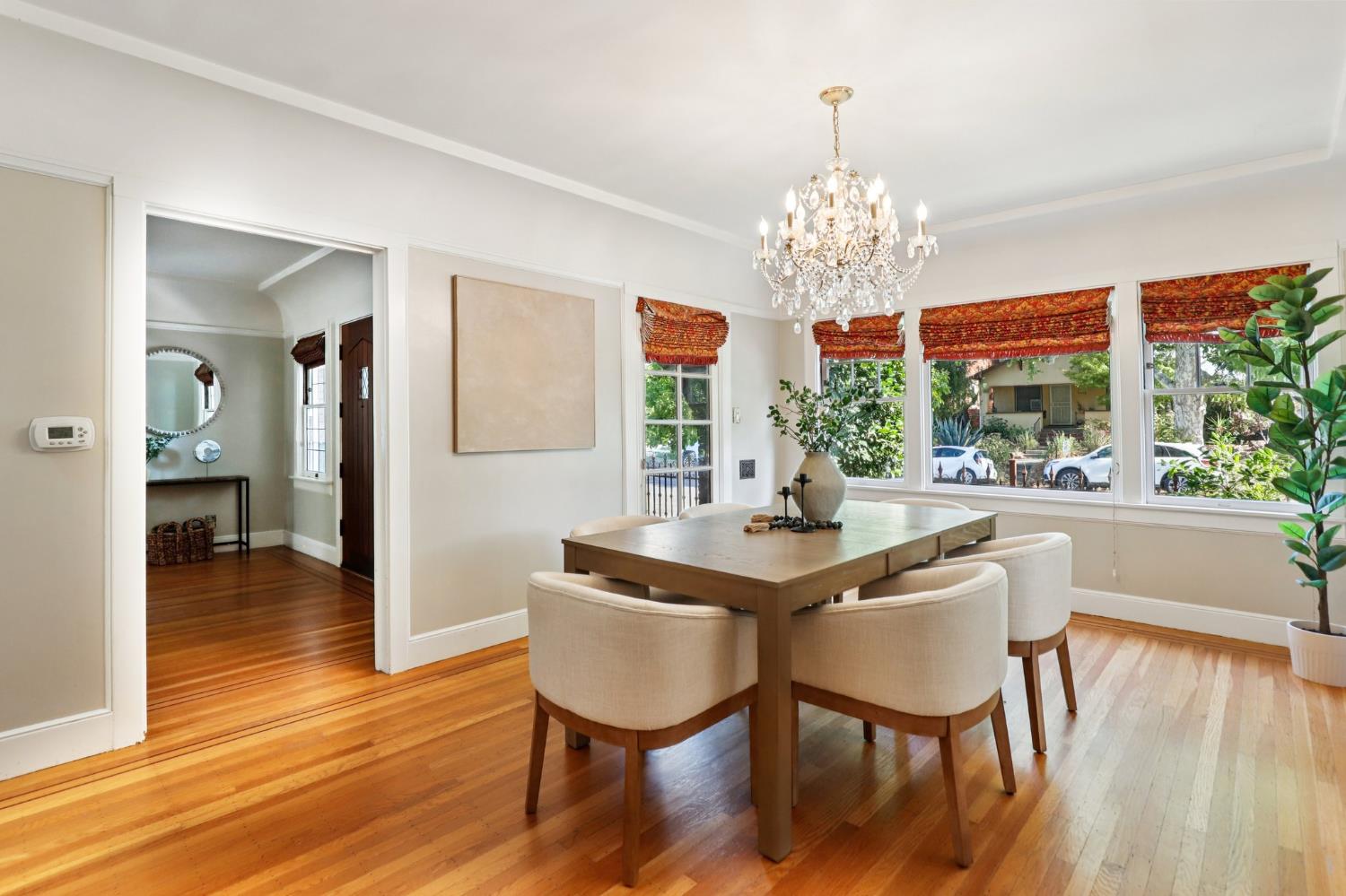 2200 2nd Avenue Sacramento, CA 95818 - Photo 17 of 69 a view of a dining room with furniture a chandelier and wooden floor