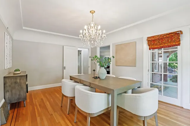 a view of a dining room with furniture and windows