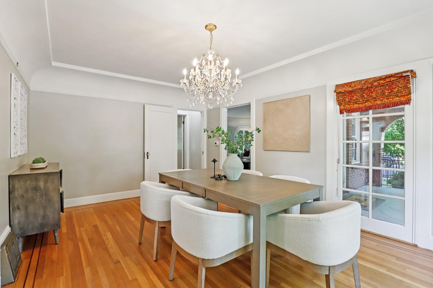 2200 2nd Avenue Sacramento, CA 95818 - Photo 19 of 69 a dining room with furniture a chandelier and wooden floor