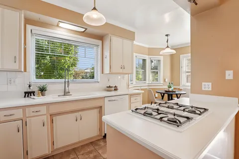a utility room with closet dryer and washer