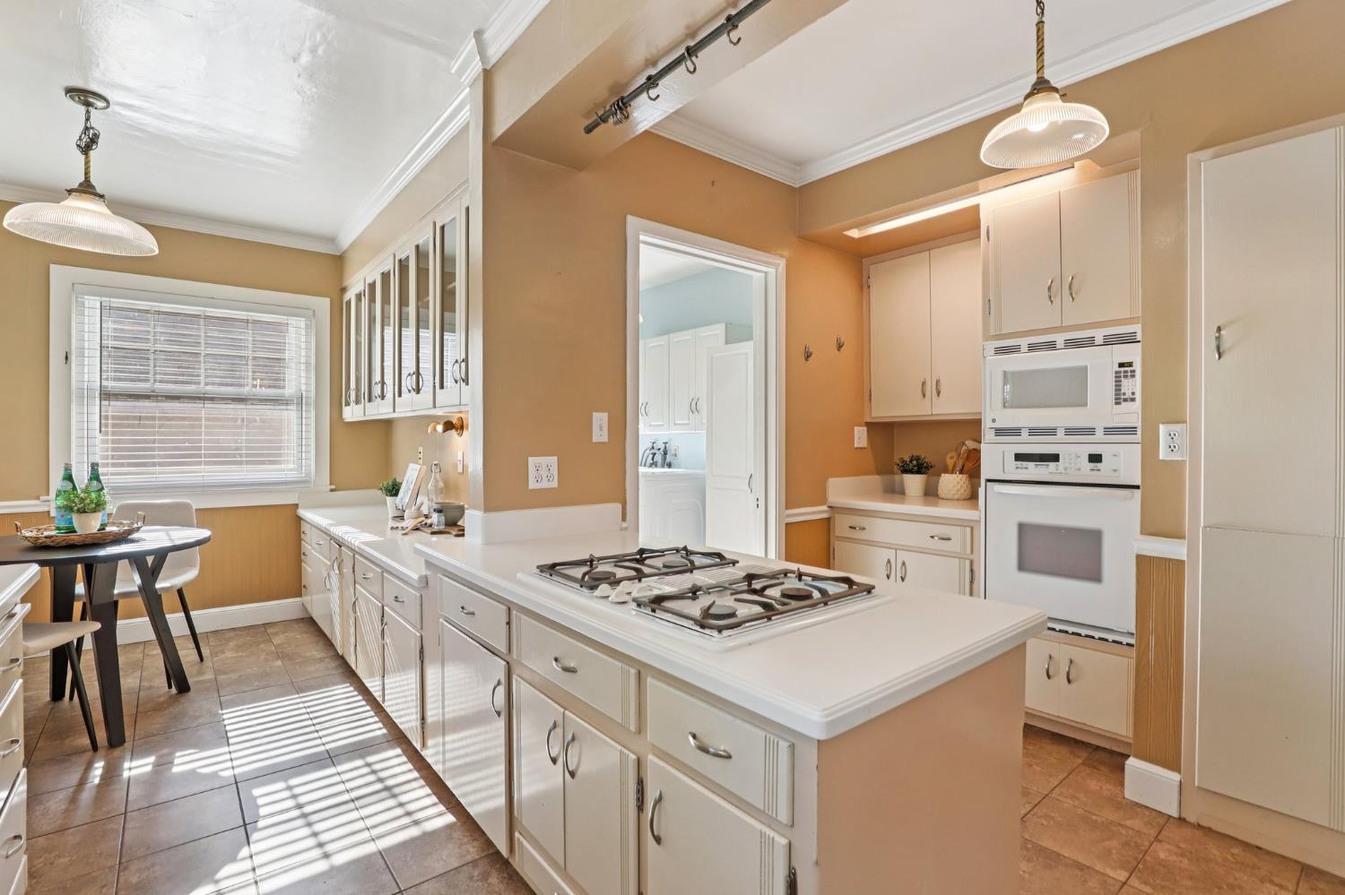 2200 2nd Avenue Sacramento, CA 95818 - Photo 23 of 69 a kitchen that has a stove and a table