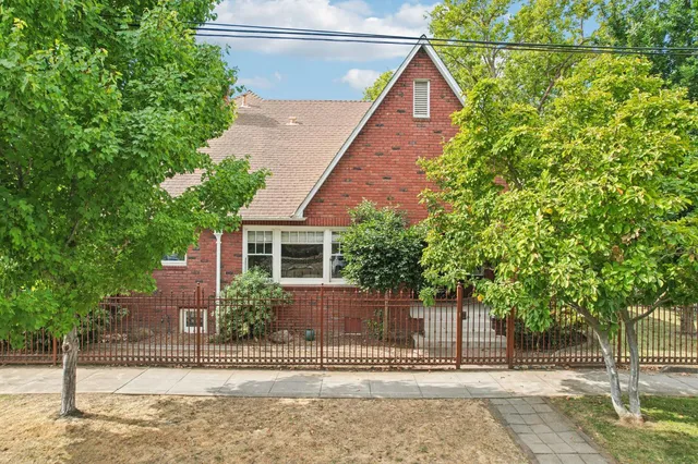 a view of a house with a small yard