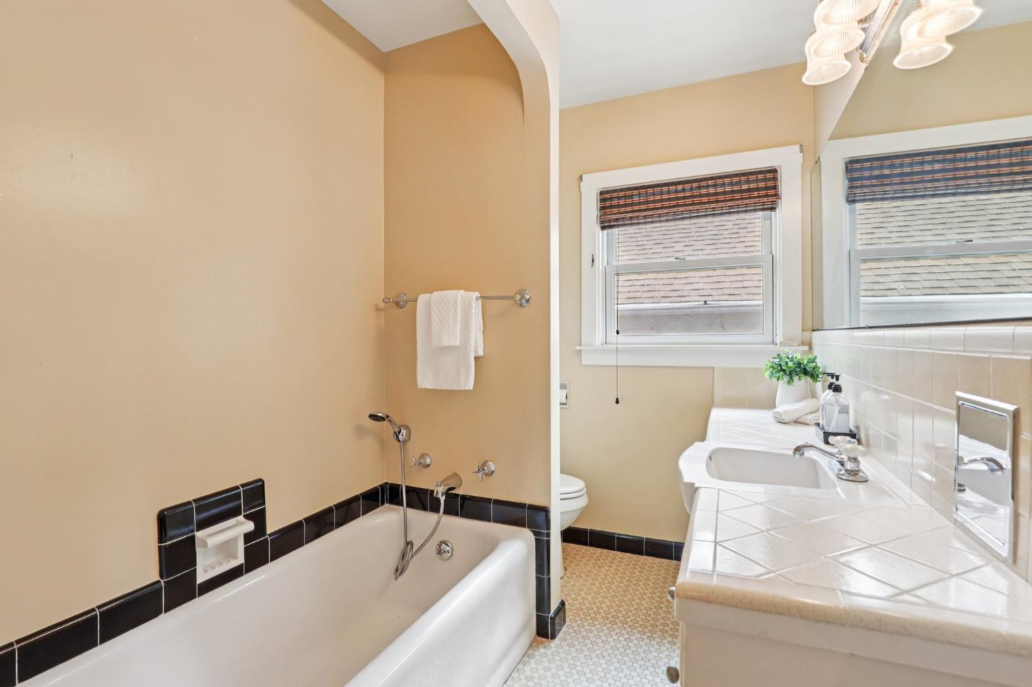 2200 2nd Avenue Sacramento, CA 95818 - Photo 33 of 69 a bath tub sitting in a bathroom next to a window