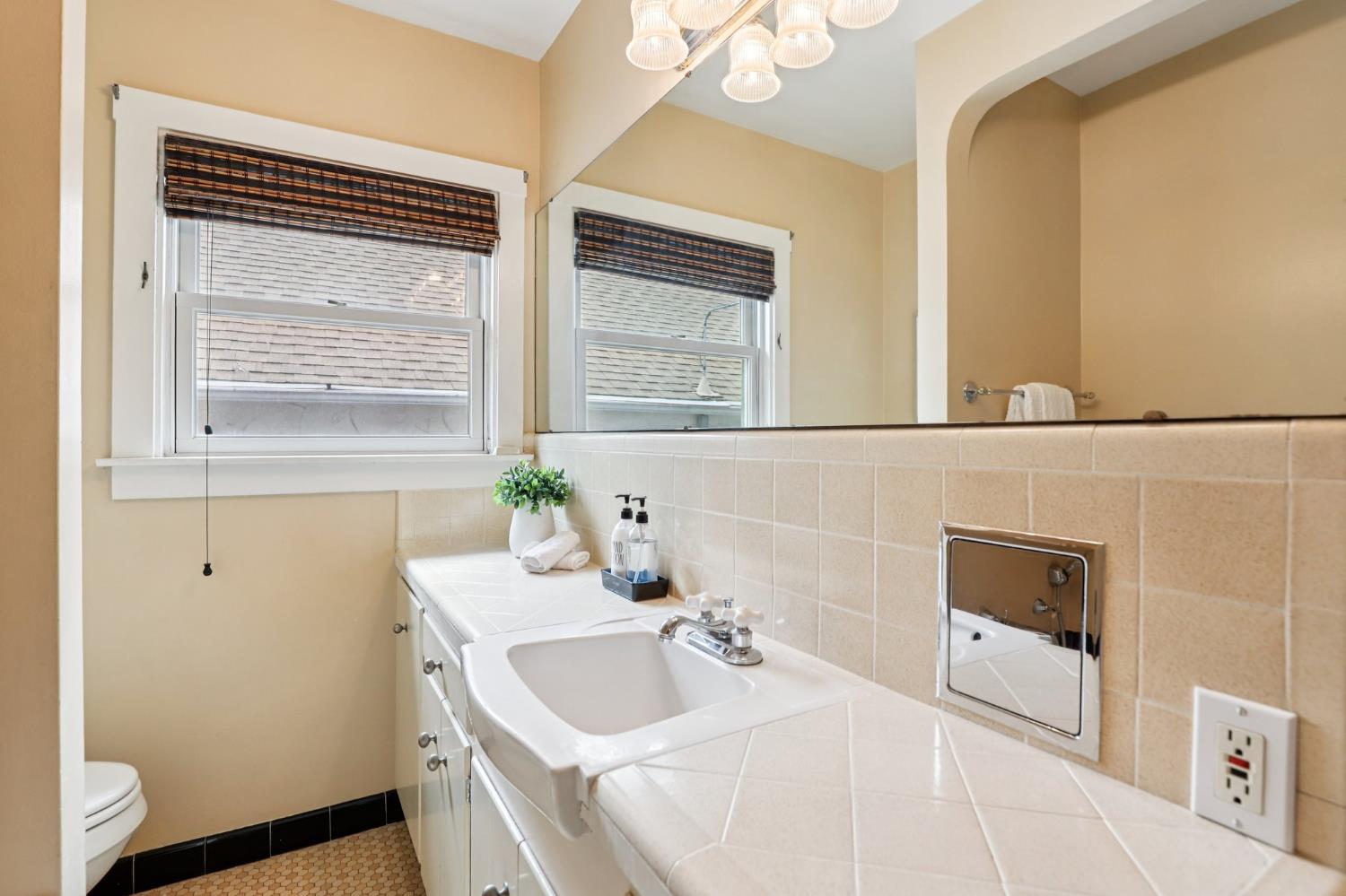2200 2nd Avenue Sacramento, CA 95818 - Photo 34 of 69 a bathroom with a sink and a mirror