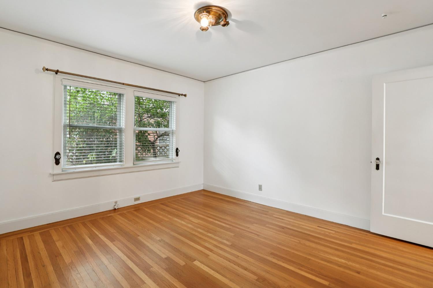 2200 2nd Avenue Sacramento, CA 95818 - Photo 40 of 69 a view of empty room with wooden floor and fan