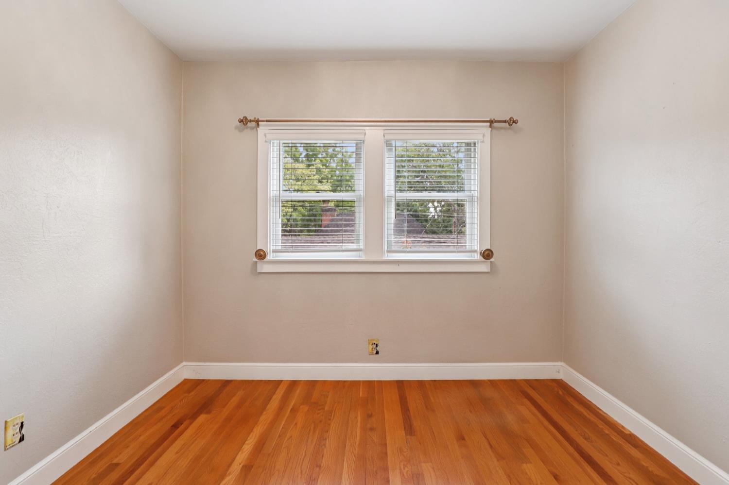 2200 2nd Avenue Sacramento, CA 95818 - Photo 48 of 69 a view of an empty room with wooden floor and a window