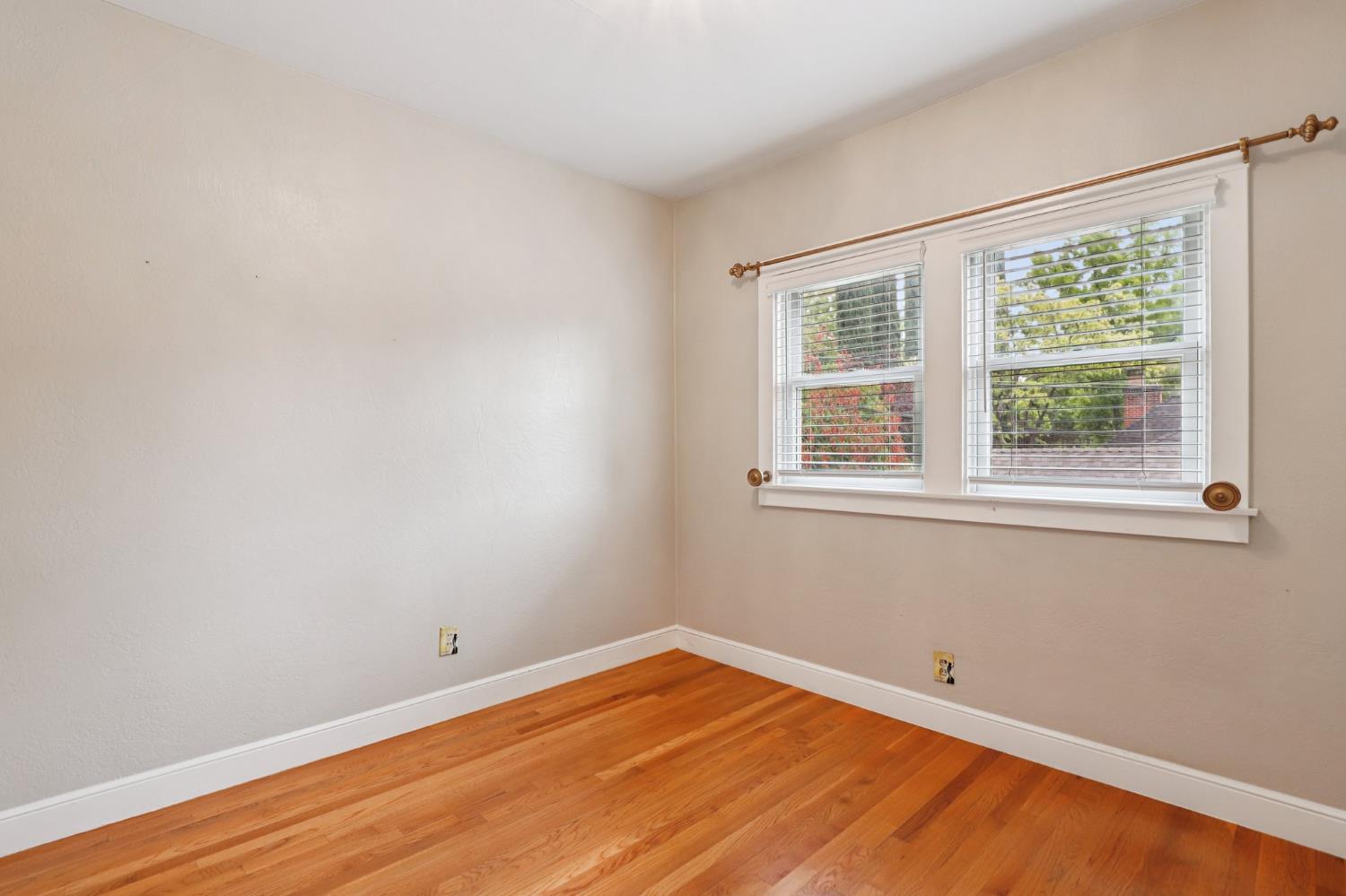 2200 2nd Avenue Sacramento, CA 95818 - Photo 49 of 69 a view of an empty room with wooden floor and a window