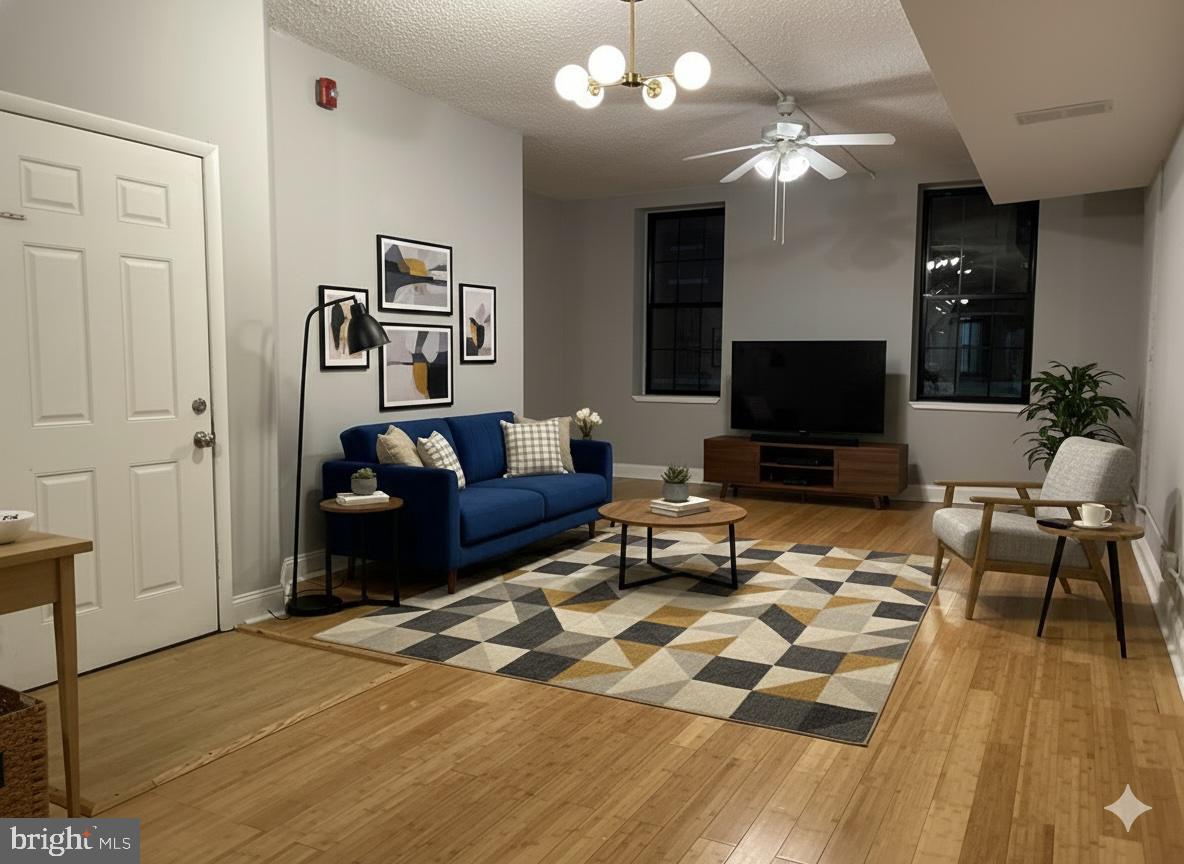 114 North 3rd Street, Unit 2 Philadelphia, PA 19106 - Photo 1 of 9 a living room with furniture and a flat screen tv
