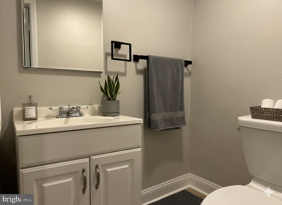 114 North 3rd Street, Unit 2 Philadelphia, PA 19106 - Photo 4 of 9 a bathroom with a sink and mirror