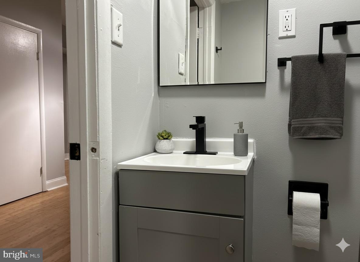 114 North 3rd Street, Unit 2 Philadelphia, PA 19106 - Photo 7 of 9 a kitchen with stainless steel appliances white cabinets and a refrigerator
