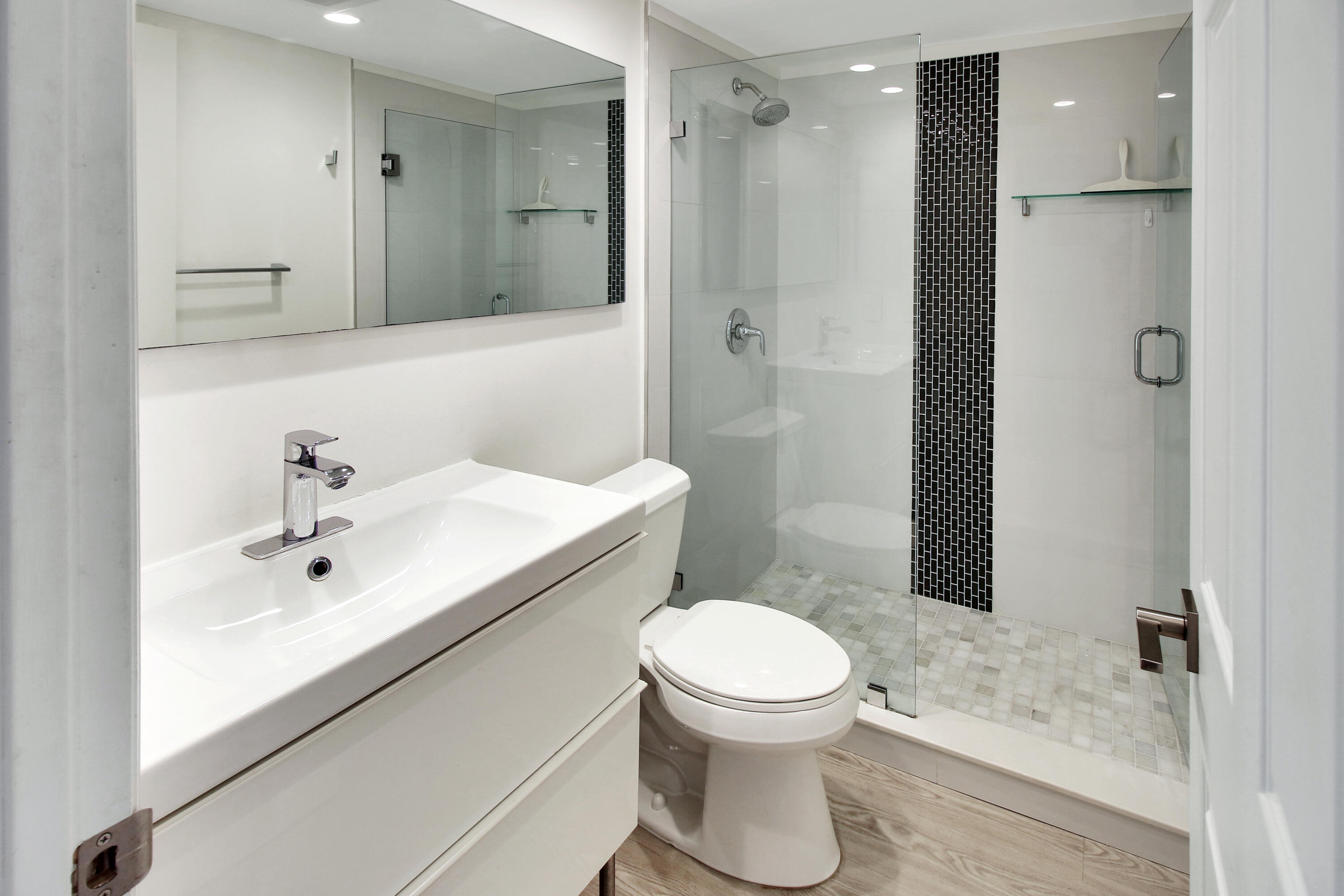 17 Fanshaw A Boca Raton, FL 33434 - Photo 8 of 11 a bathroom with a toilet sink and shower