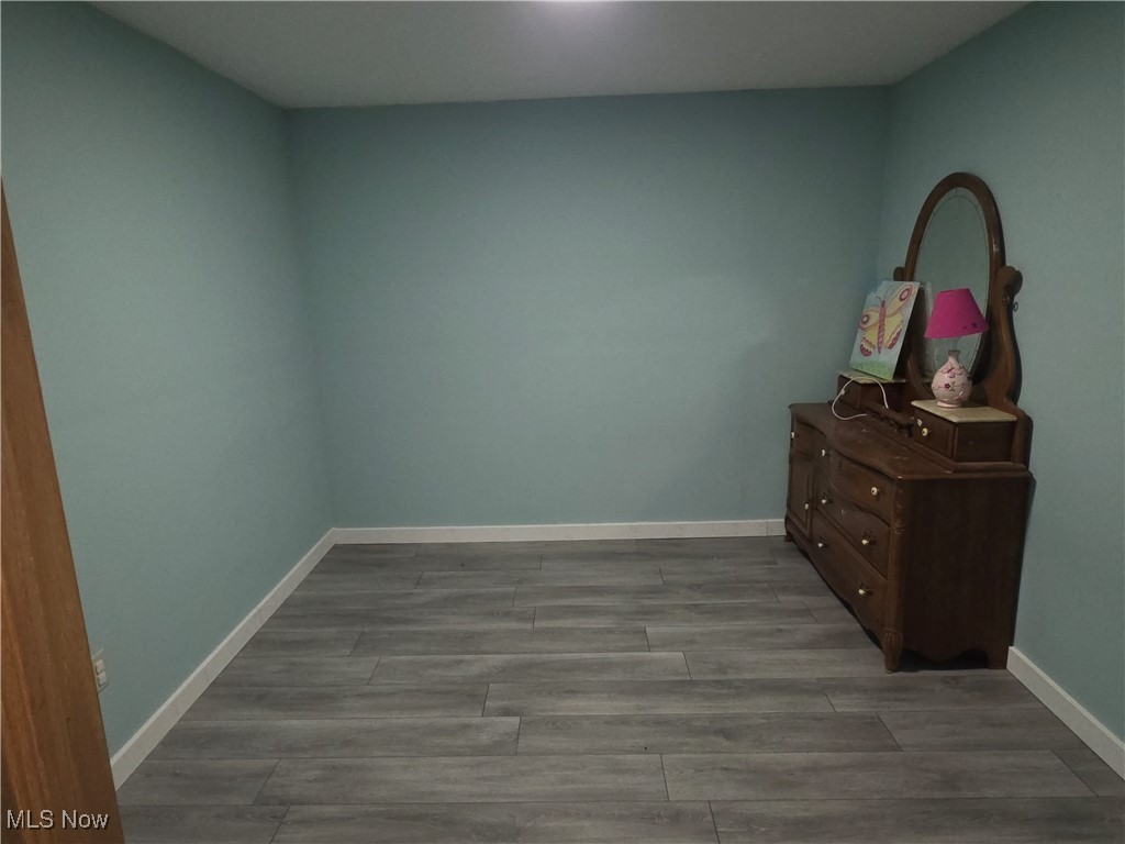 2291 Armstrong Road Wooster, OH 44691 - Photo 16 of 23 Finished bonus room in the basement with wood vinyl floors and baseboards