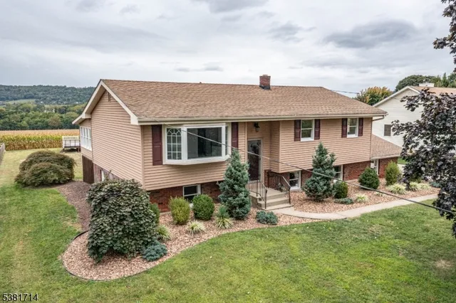 a aerial view of a house with a yard