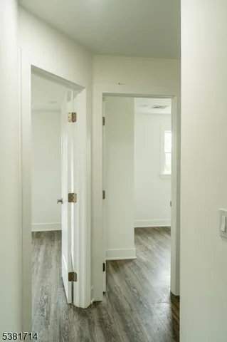a view of a bathroom with wooden floor