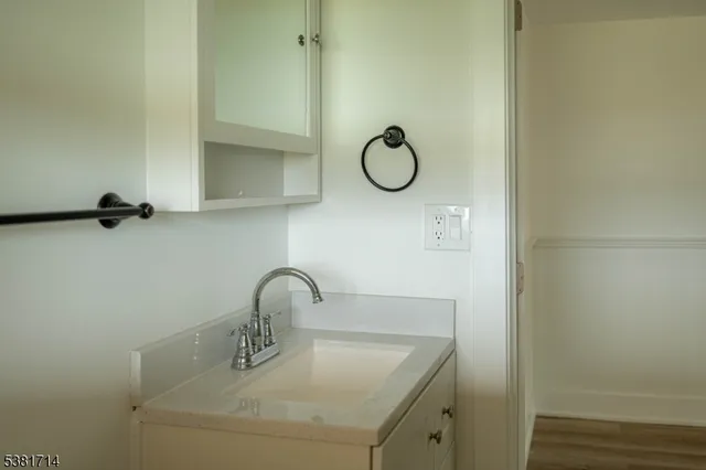 a bathroom with a sink and mirror