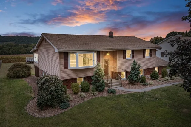 a front view of a house with a yard