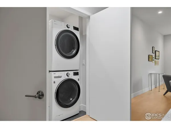 a view of a hallway with washer and dryer