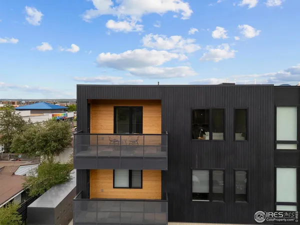a aerial view of a house with a yard