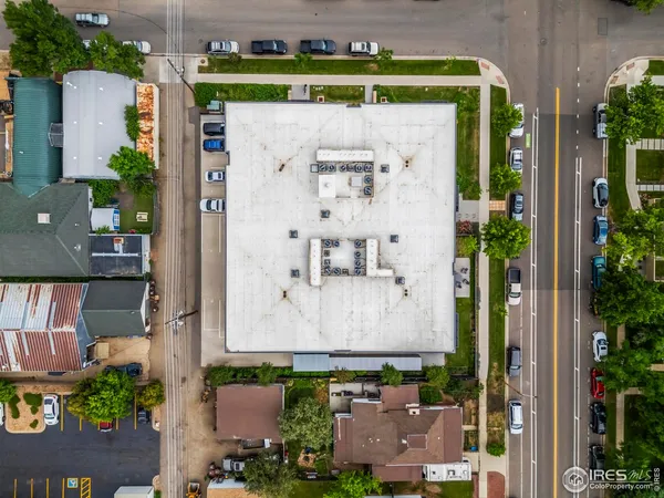 an aerial view of a house with a yard and a fountain