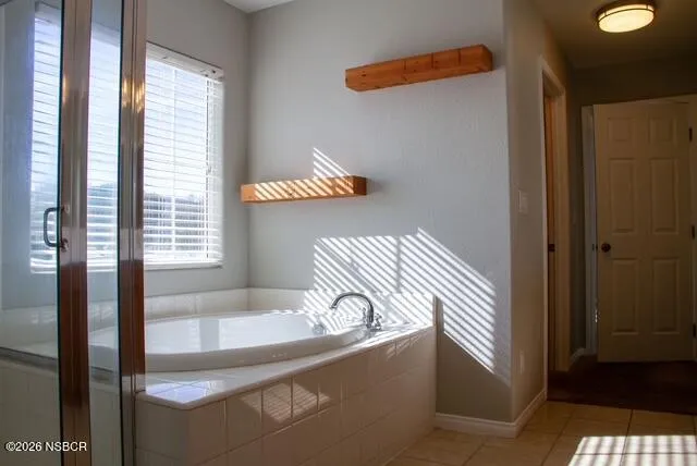 a view of a bath tub sitting in a bathroom