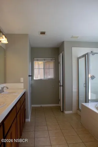 a room with a sink cabinets and utility room