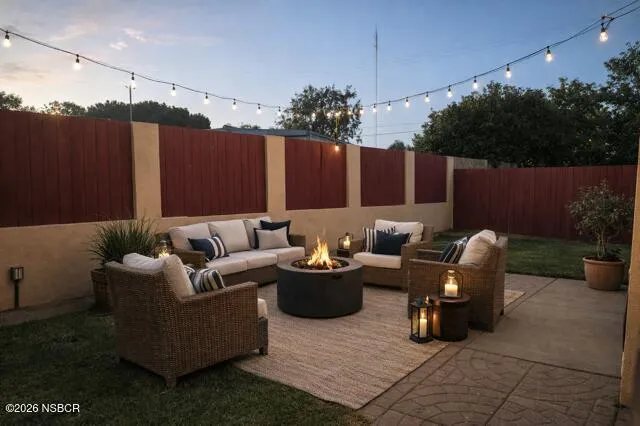 a couch in patio with potted plants