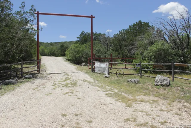 a view of backyard with swimming pool and outdoor seating