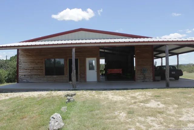 a view of house with swimming pool