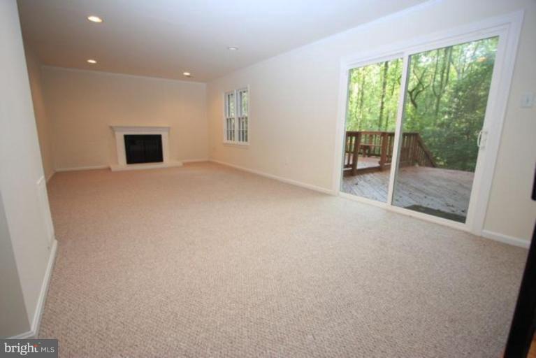 11322 Myrtle Lane Reston, VA 20191 - Photo 16 of 24 a view of a livingroom with wooden floor and a floor to ceiling window