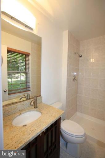 11322 Myrtle Lane Reston, VA 20191 - Photo 10 of 24 a bathroom with a granite countertop sink toilet and shower
