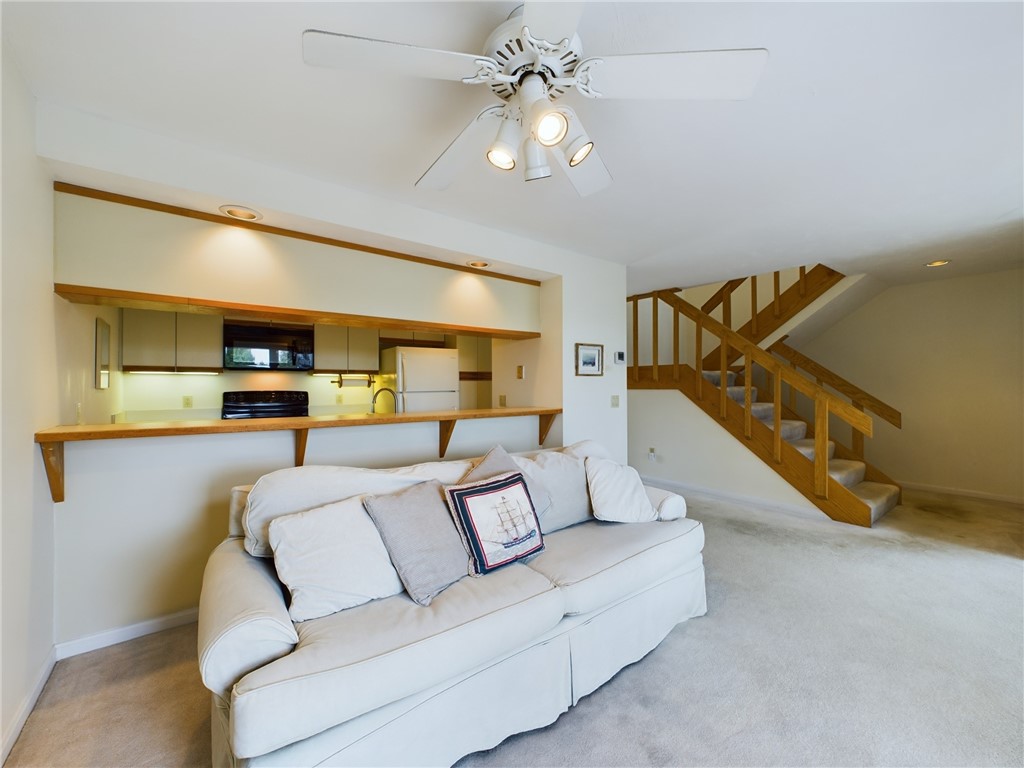1125 Point Judith Road, Unit E5 Narragansett, RI 02882 - Photo 7 of 27 Stairs up to primary bedroom, down to garage/entry