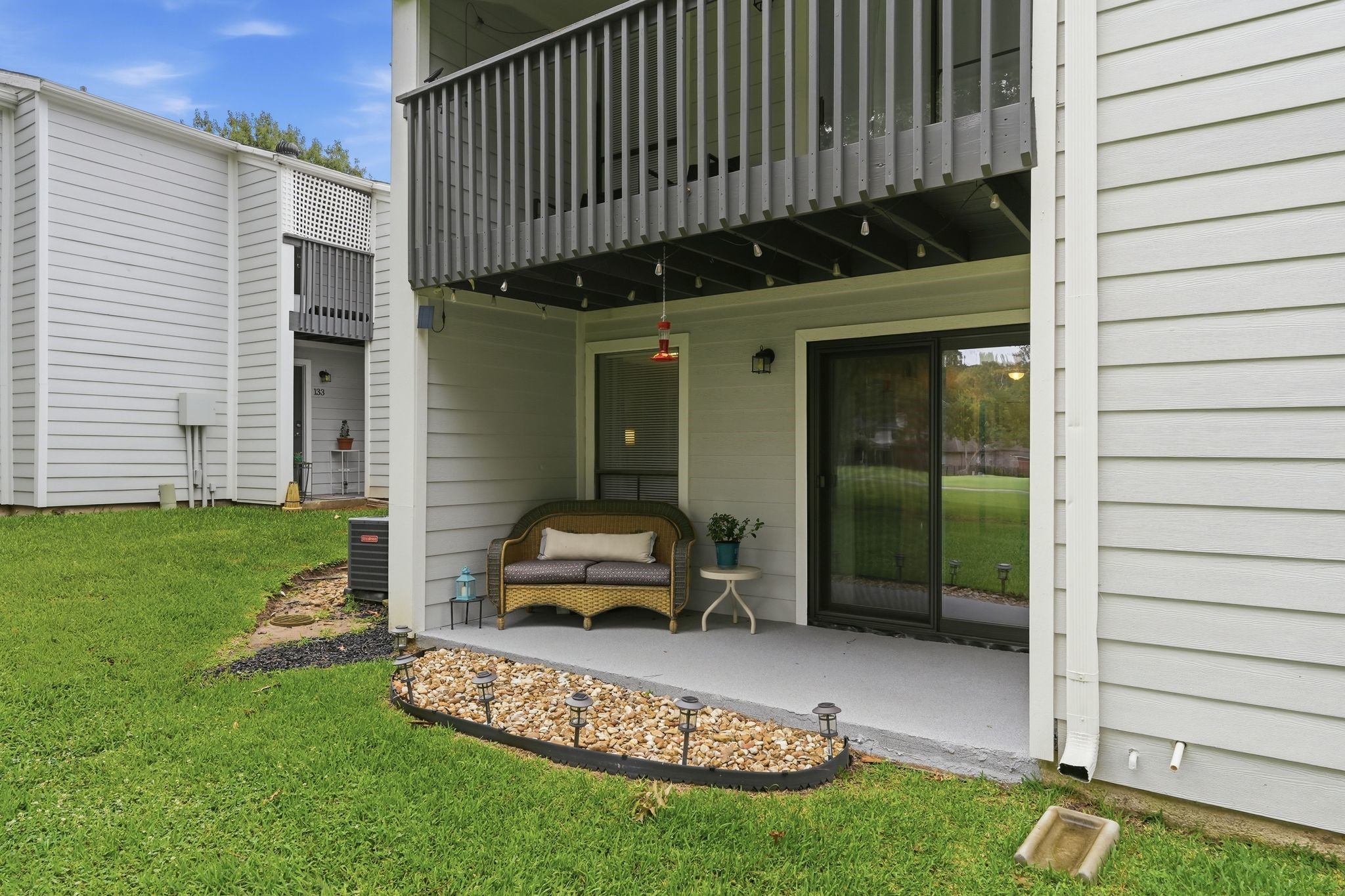 13151 Walden Road, Unit 131 Montgomery, TX 77356 - Photo 19 of 35 Rear exterior showcasing private outdoor space and easy access to the patio.
