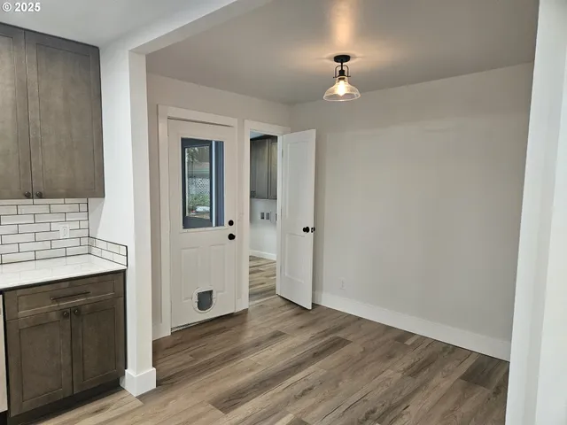 a stove top oven sitting inside of a kitchen