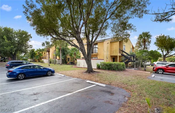 a car parked in front of a house on a sidewalk