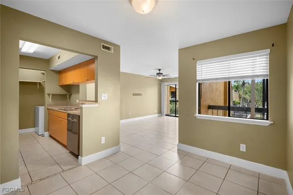 a view of a kitchen with a sink cabinets and a window