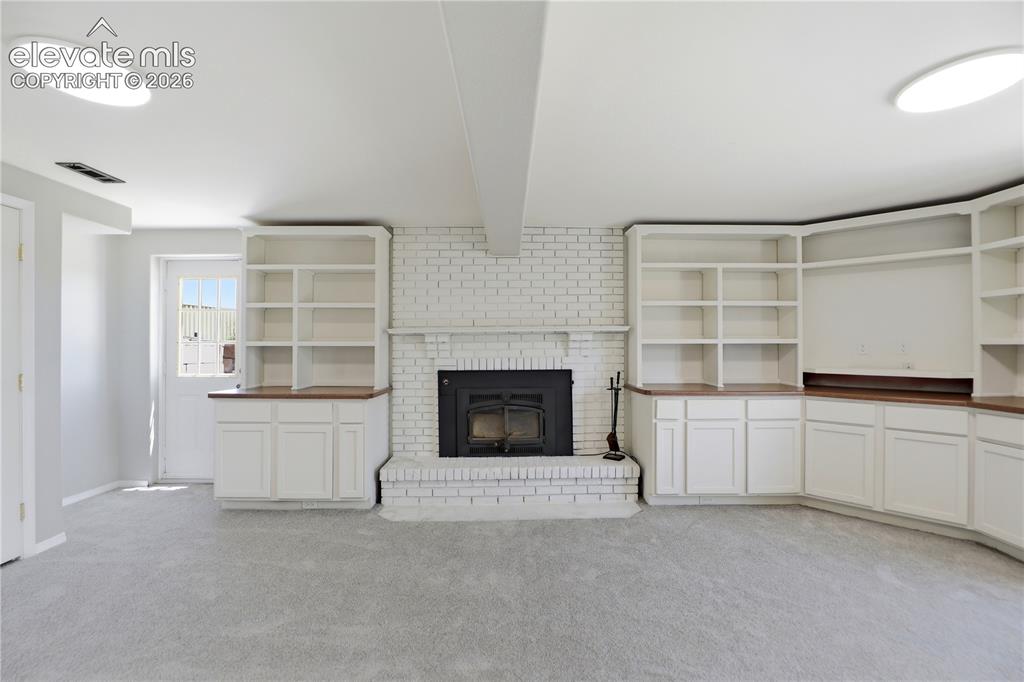 19027 Murphy Road Peyton, CO 80831 - Photo 25 of 48 Carpet, Closets, Built Ins, Fireplace, Dry Bar