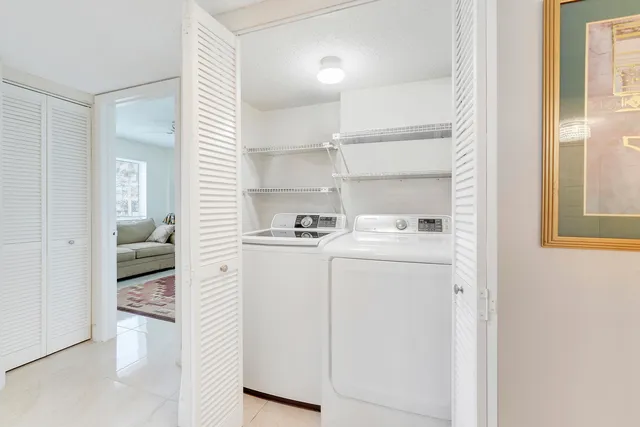 a sign board with yard and green space