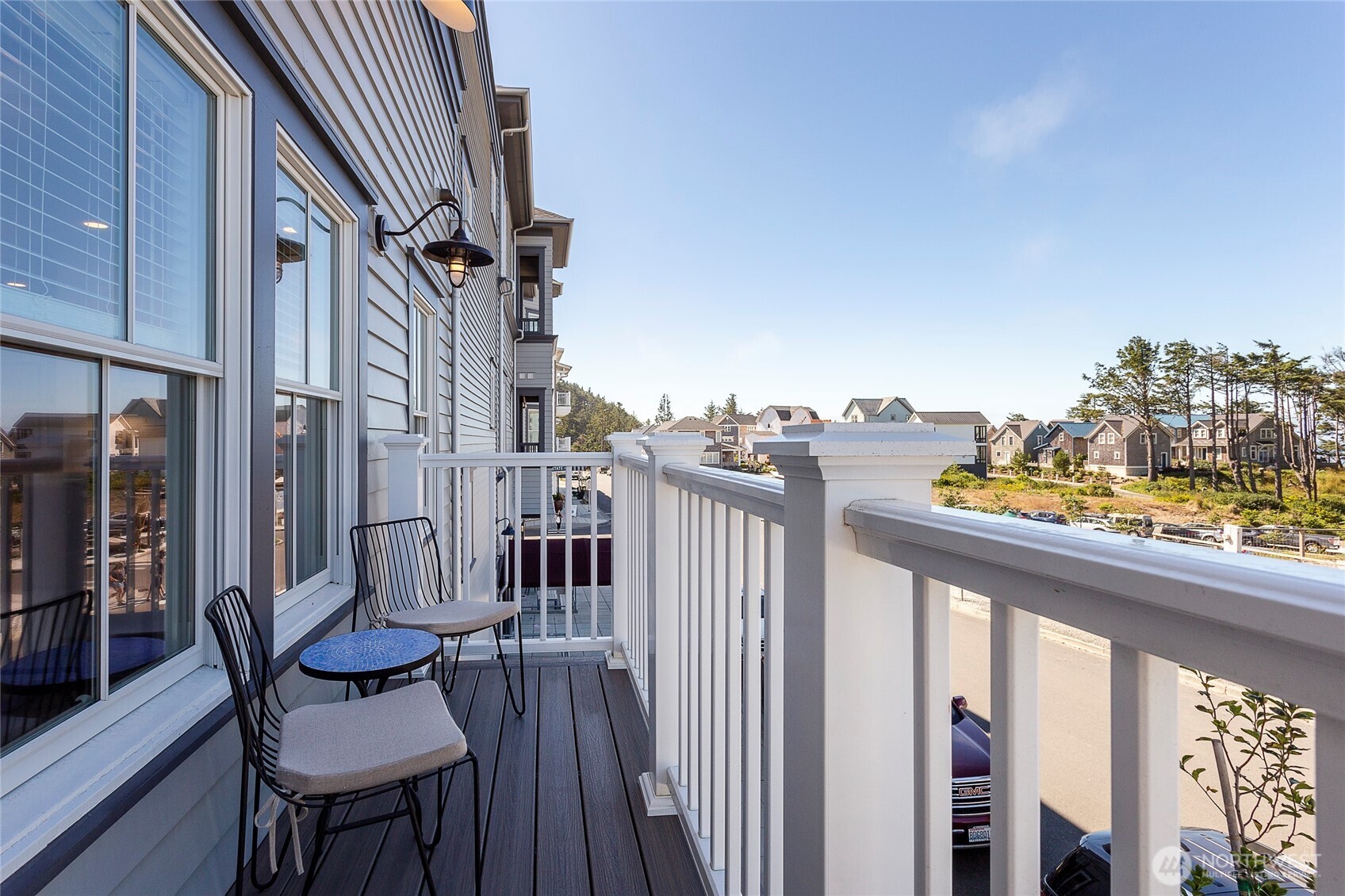 a view of a balcony with chairs