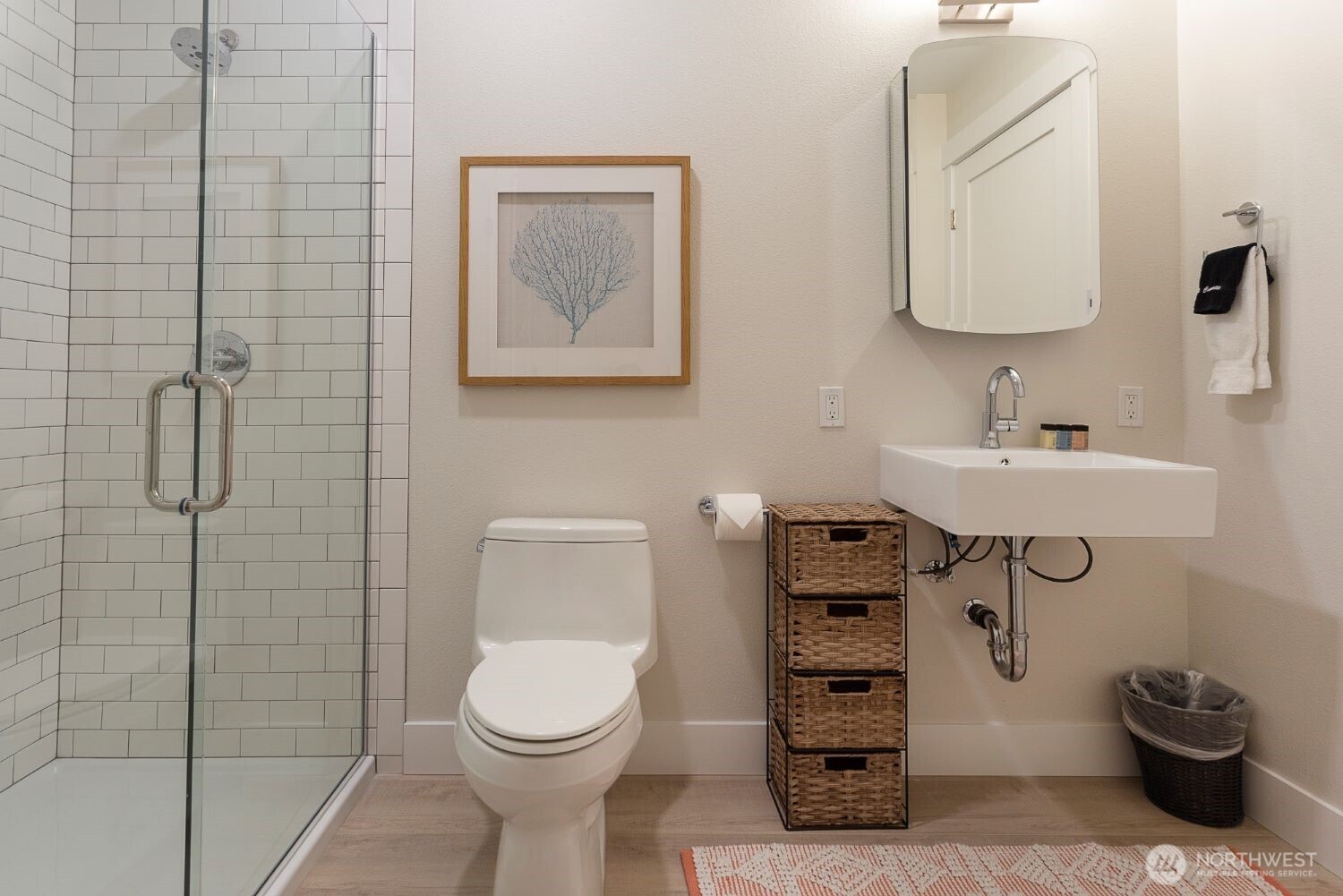 203 Market Street, Unit D Pacific Beach, WA 98571 - Photo 15 of 16 a bathroom with a toilet sink and shower