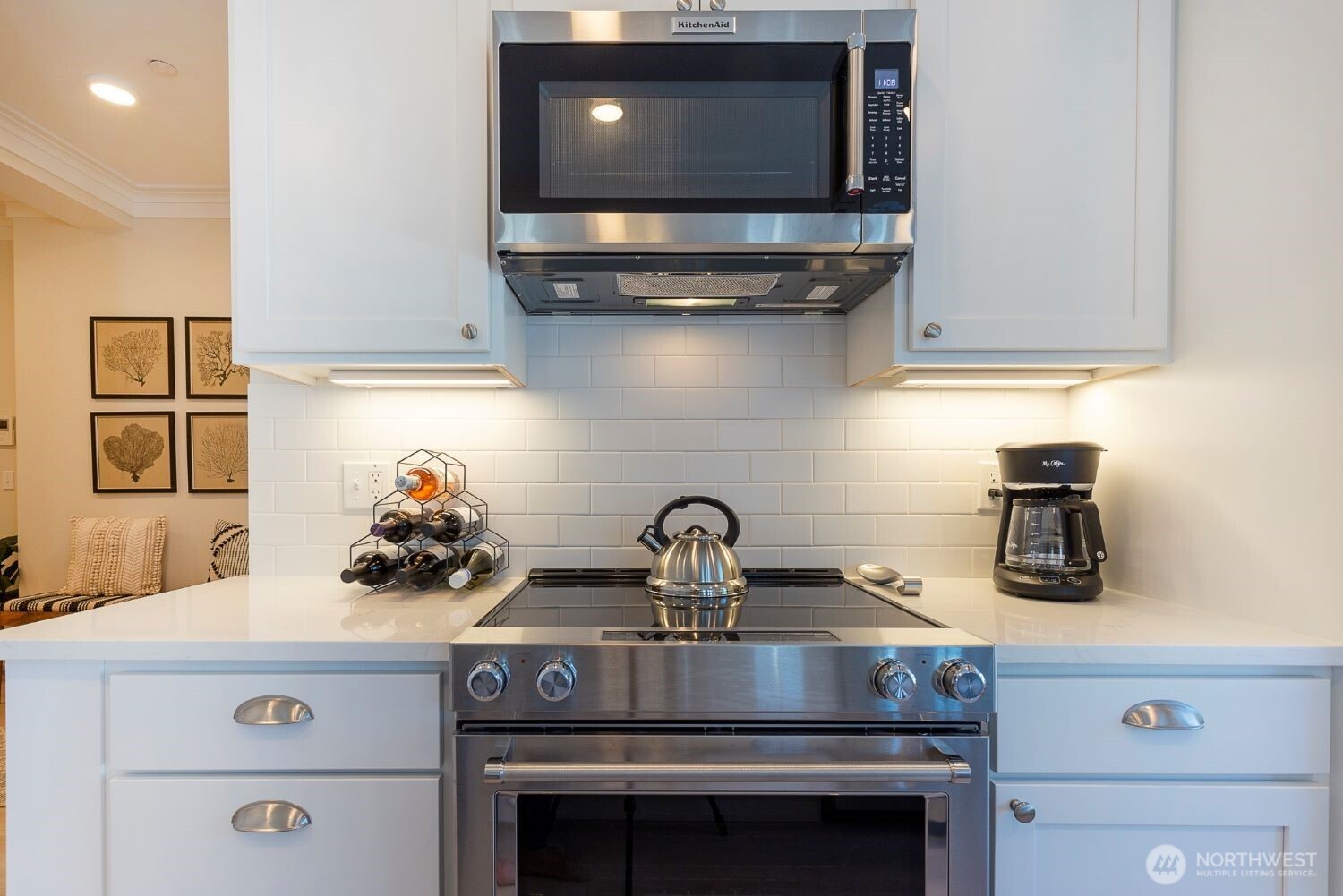 203 Market Street, Unit D Pacific Beach, WA 98571 - Photo 5 of 16 a kitchen with a stove and a microwave