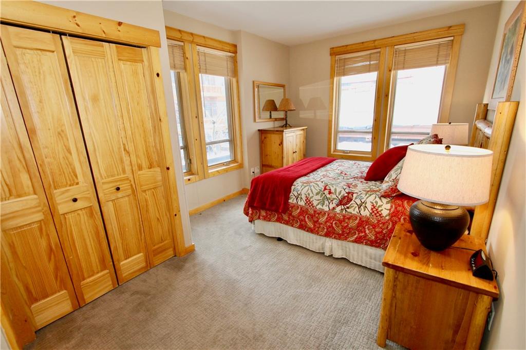 172 Copper Circle, Unit 210 Copper Mountain, CO 80443 - Photo 11 of 25 a bed room with a bed and a window