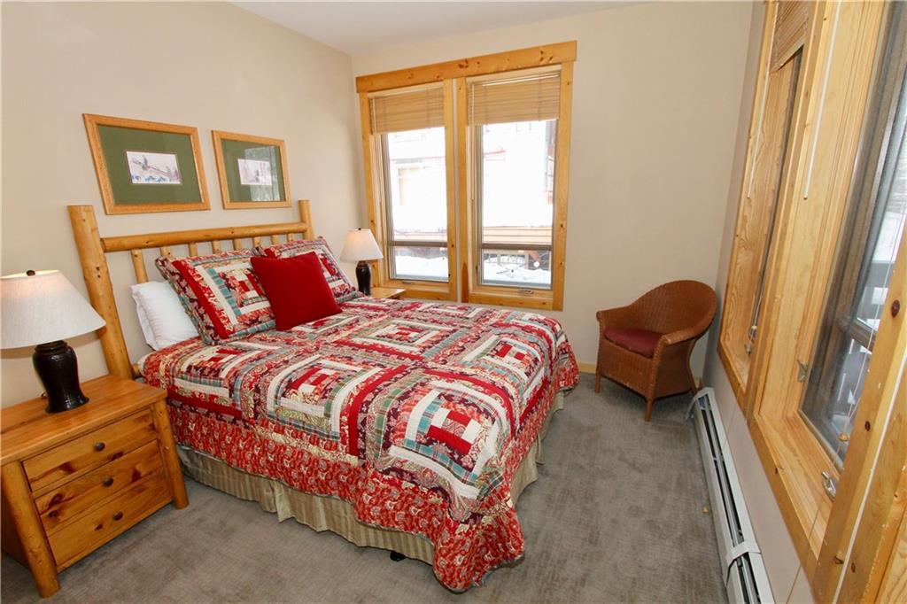 172 Copper Circle, Unit 210 Copper Mountain, CO 80443 - Photo 14 of 25 a bedroom with a bed and a window