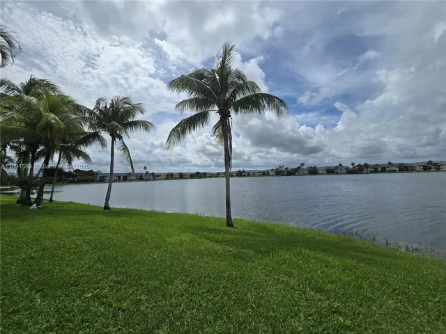 a view of a lake and a yard