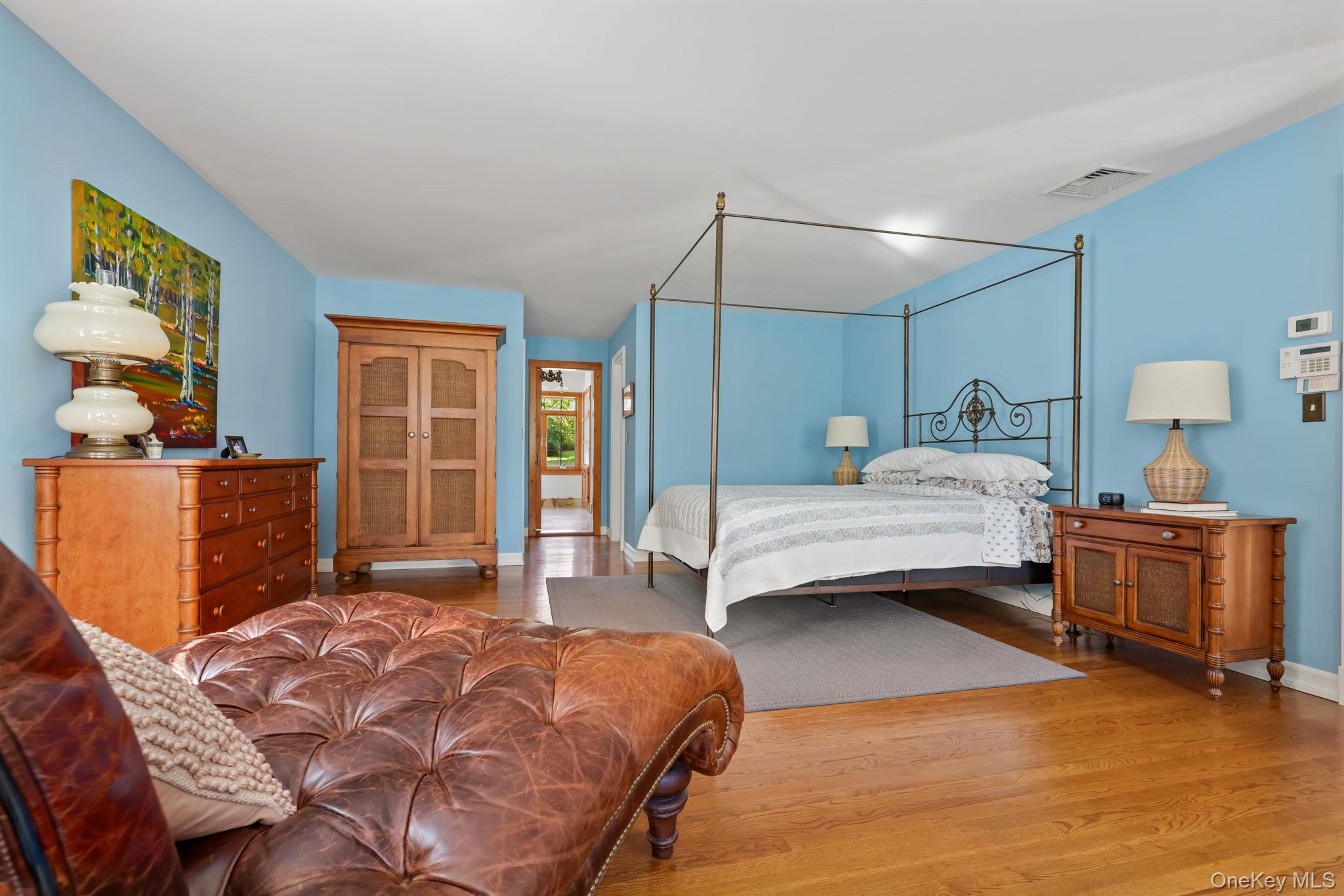 21 Adams Farm Road Katonah, NY 10536 - Photo 20 of 47 a bedroom with a bed and wooden floor