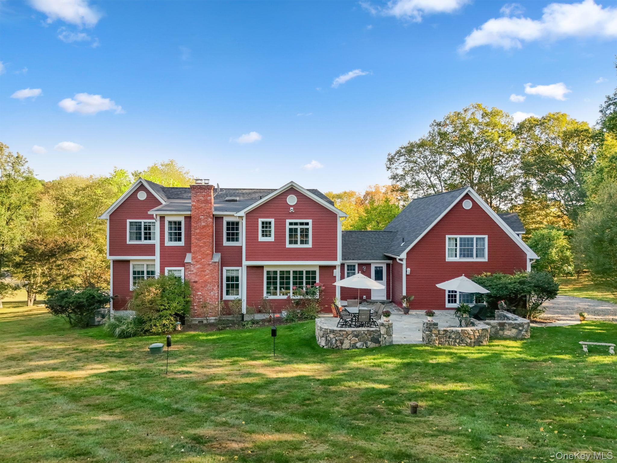 21 Adams Farm Road Katonah, NY 10536 - Photo 37 of 47 a front view of a house with a yard